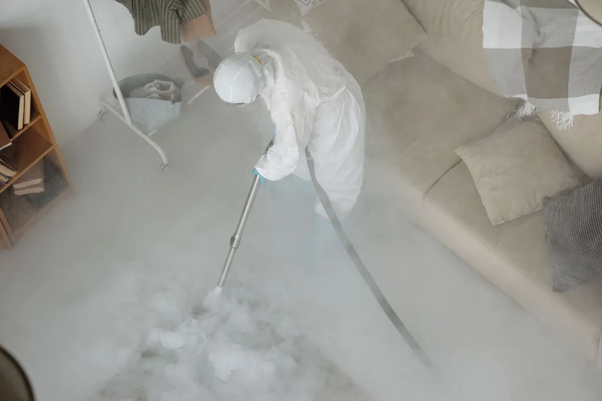 Biohazard cleanup technician in protective equipment, Hugo, MN